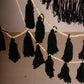 Macramé mural en coton avec pompons